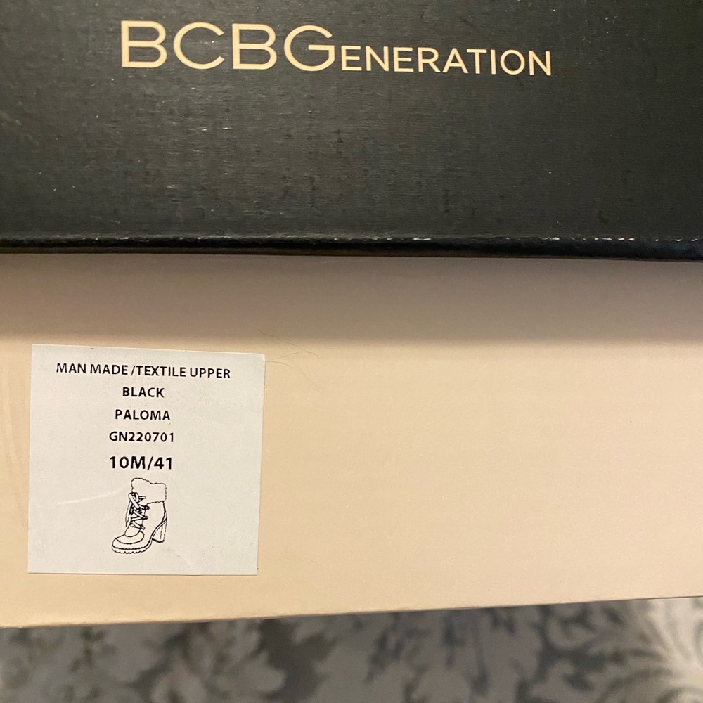 Excellent condition, never worn, black BCBG lace up boot